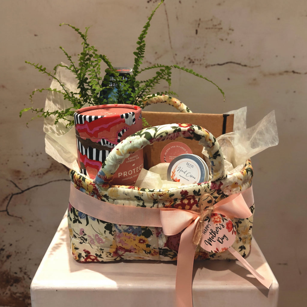 "Protect" Hamper in floral fabric storage basket with a plant