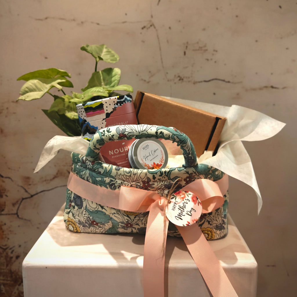 "Nourish" Hamper in floral fabric storage basket with a plant