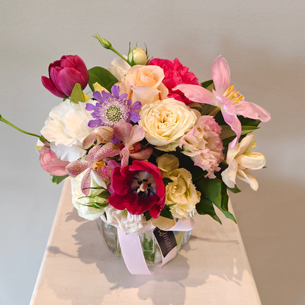 Mixed flowers posy in a vase
